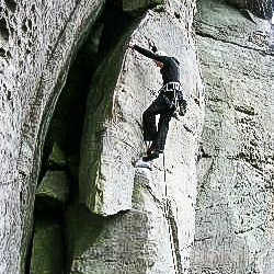 picture of kathleen on the rocks climbing